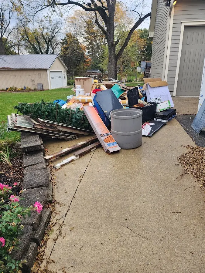 Dumpster being loaded with debris for Commercial Dumpster Rental in Birmingham